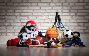 A display of sports mouthguards on a brick wall.