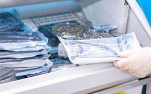 A person is holding a bag of medical equipment.